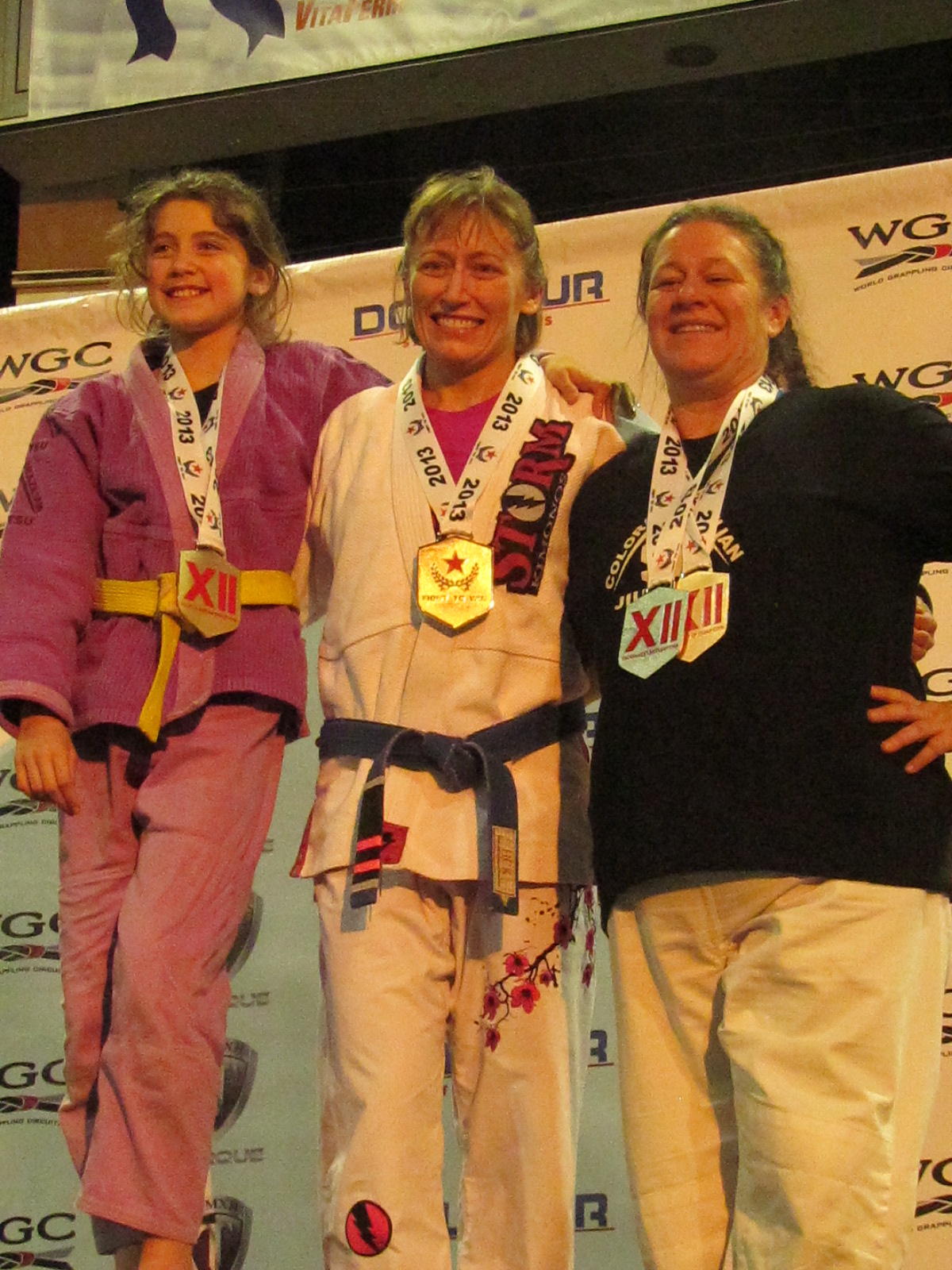 CBJJ Stapleton Ladies on the Medal Stand - 2013 Fight To Win Tournament of Champions 12 - Kate Stewart (Gold) - Teri Stewart (Gold) - Heather Westman (Silver & Bronze)